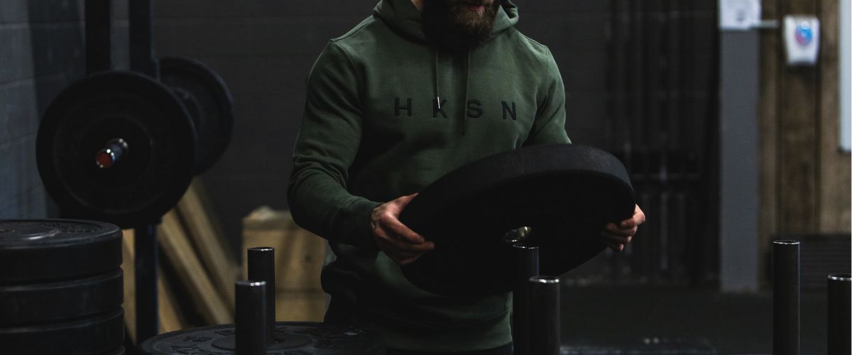 Athlete racks weights in gym