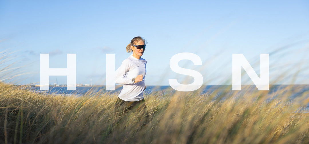 Lady runs through dunes